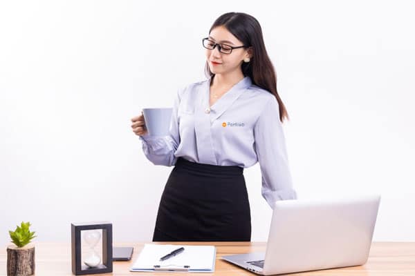 virtual assistant medical biller holding a cup of coffee