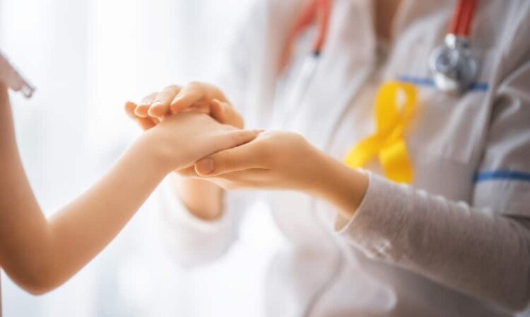 doctor and patient holding hands