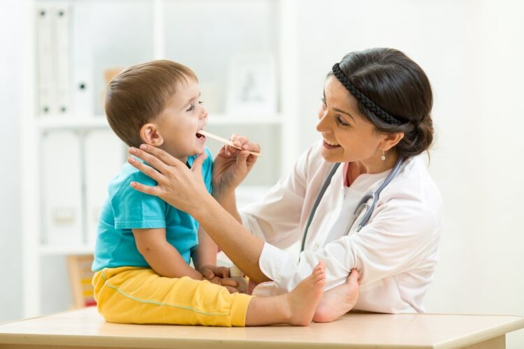 helping doctor and a child patient