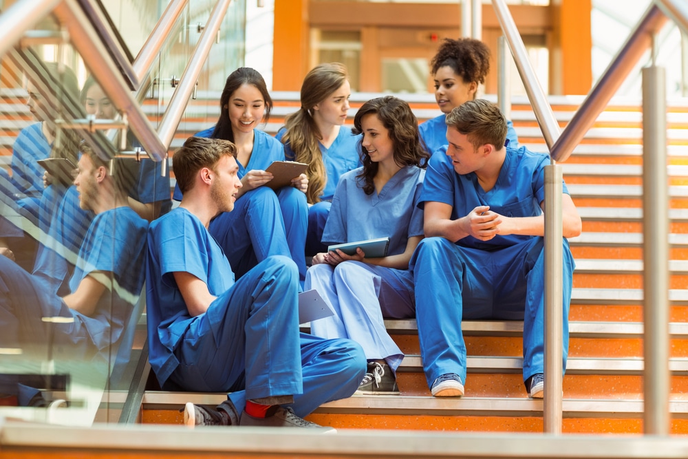 virtual medical administrative assistant nurses sitting in the staircase