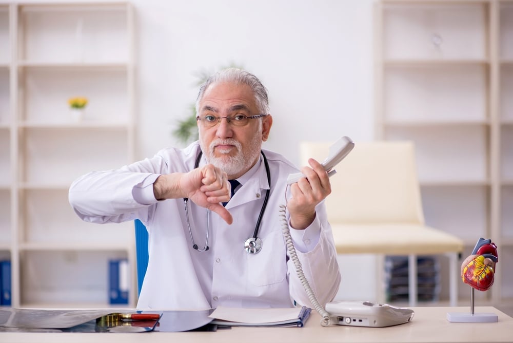 Old male doctor radiologist working in the clinic