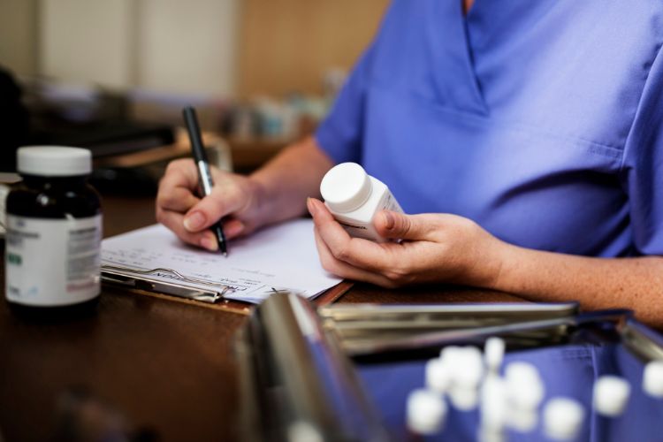 authorization nurse writing a prescription