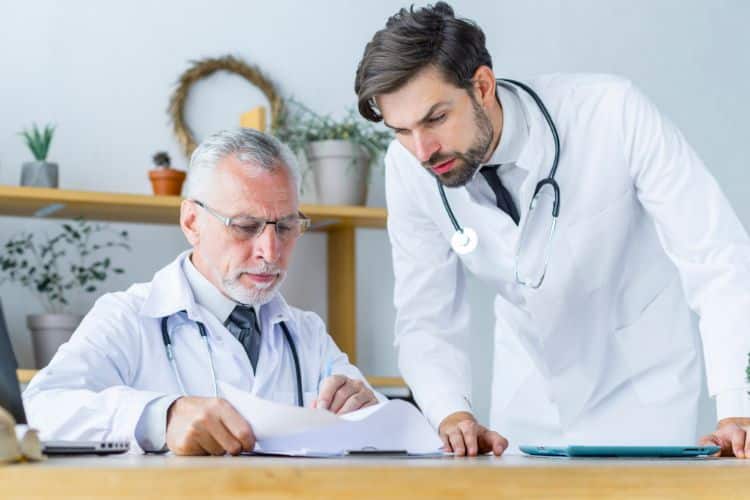 certifications showed by a senior doctor to young colleague