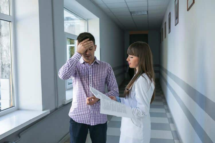 clinical pharmacist giving medicine prescription to a patient