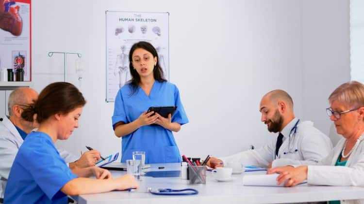 healthcare providers communicating with a pharmacist