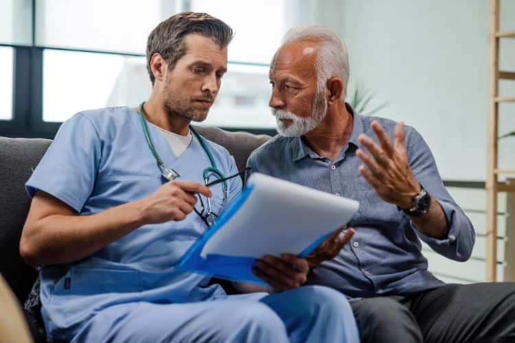 medical necessity senior man talking to a doctor