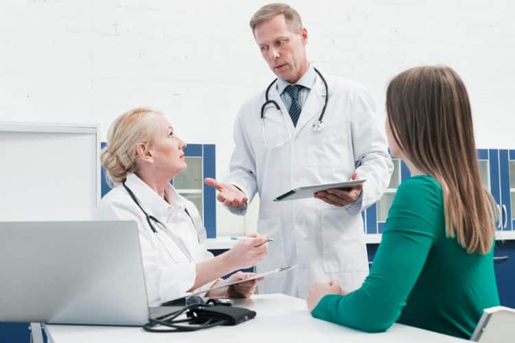 prior authorization insurance a doctor tending to a patient