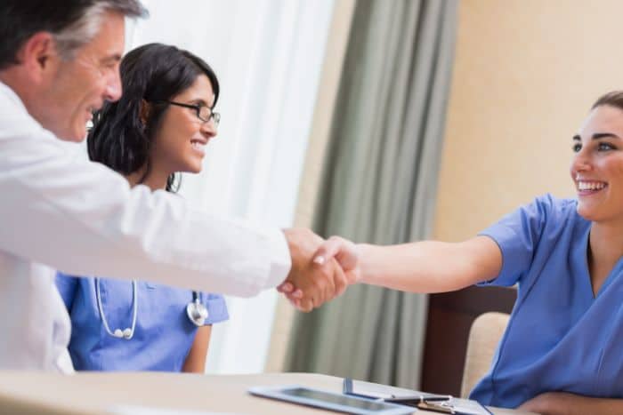 value-based care and preauthorization dynamics shakehands doctor and nurse