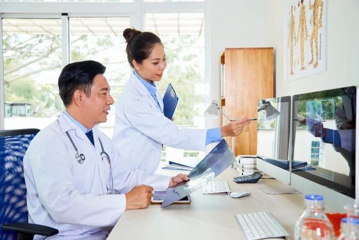 electronic prior authorization's critical role doctor pointing the monitor