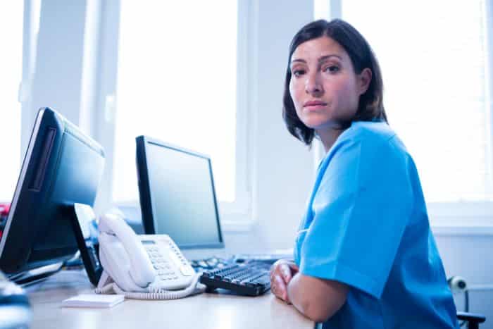 healthcare prior authorization system medical doctor sitting at the office