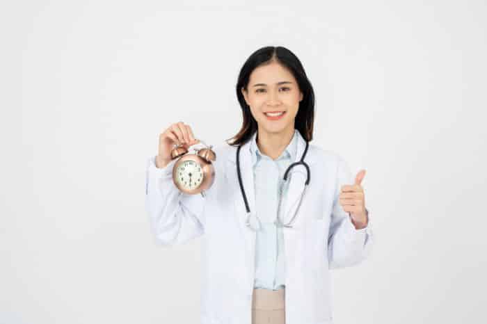 investing in pre-approval services doctor holding clock