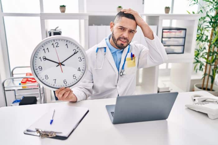 optimal precertification service implementation doctor holding clock