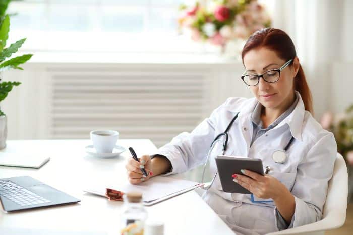 securing the future with prior authorization services doctor holding phone