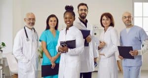 Prior Authorization Policy Reform doctors holding clipboard and smiling