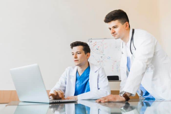 cutting down on issues with effective preauthorization doctor looking at the laptopcutting down on issues with effective preauthorization doctor looking at the laptop