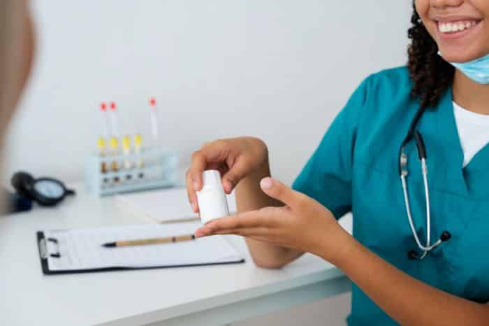 exploring the impact of prior authorization on patient care and outcome nurse holding medicine