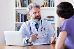 prior authorization's impact on healthcare access doctor talking to the patient