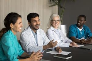 providers vs. payers in prior authorization doctor taking while smiling