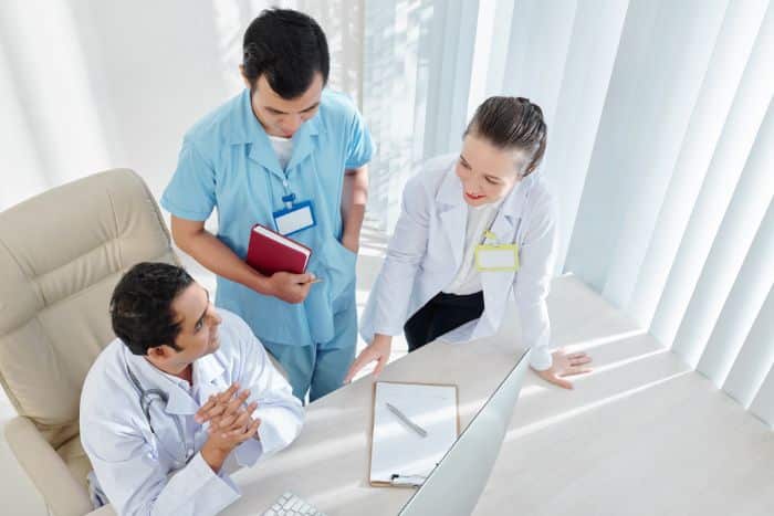 quality patient care with outsourced prior authorization doctors discussing