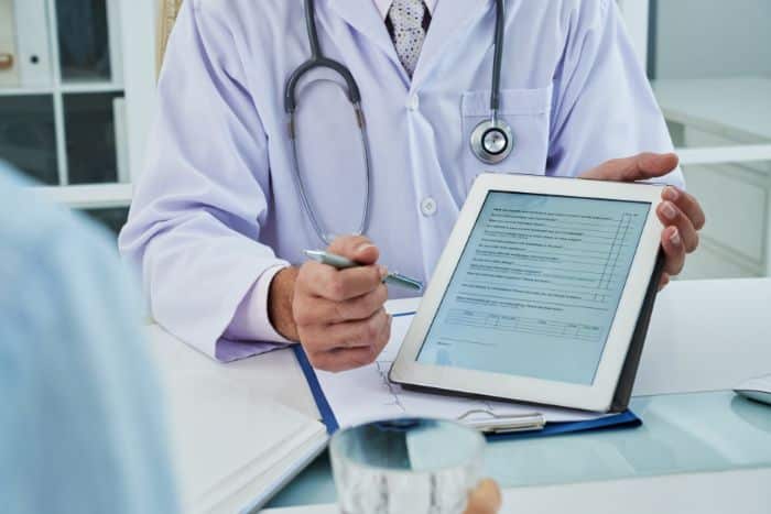 the significance of prior approval in today's healthcare person holding the tablet