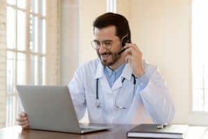 embracing virtual medical receptionists, doctor using technology