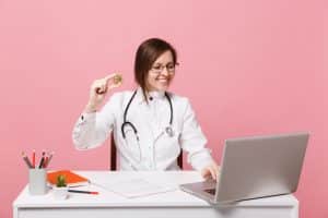 employing a virtual medical receptionist doctor holding a money and using laptop