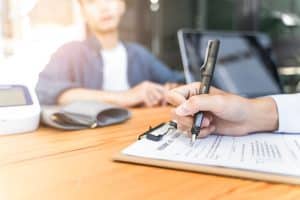 employing a virtual medical receptionist hand writing on the clipboard