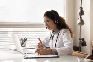 patient contentment with virtual medical receptionists doctor talking someone online