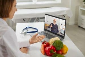 patient contentment with virtual medical receptionists doctor talking to the old patient