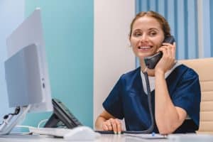 qualities of virtual medical receptionist, happy doctor using a telephone