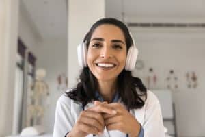 qualities of virtual medical receptionist, happy doctor using headphone