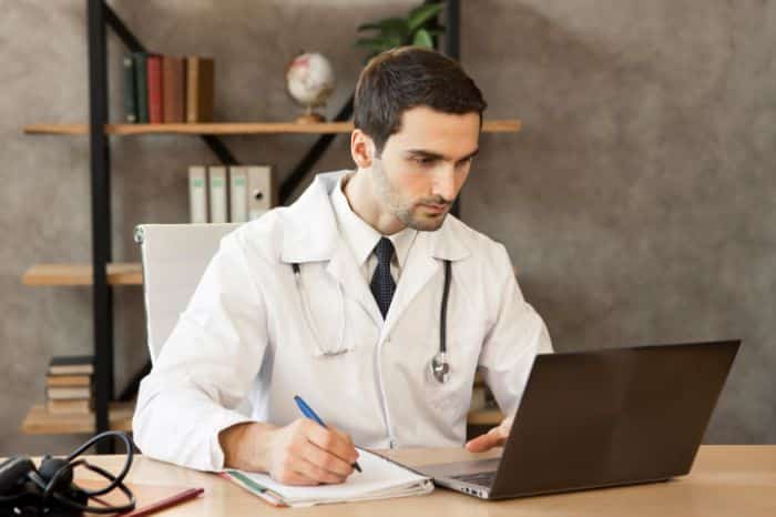 virtual medical receptionist can do for you, doctor working with the laptop