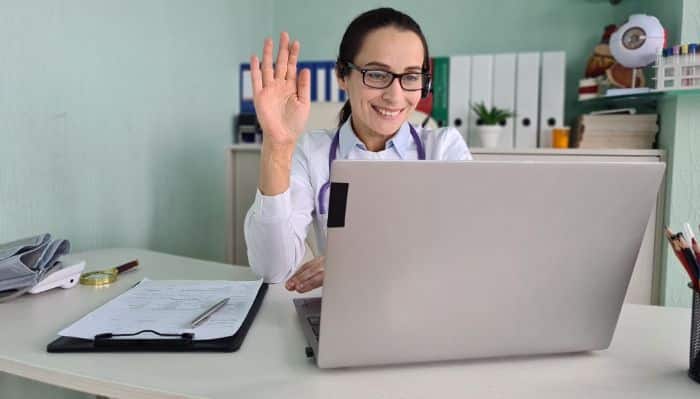 virtual medical receptionist efficiency, happy female doctor talking virtually