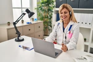 virtual medical receptionist is essential, happy VA doctor working