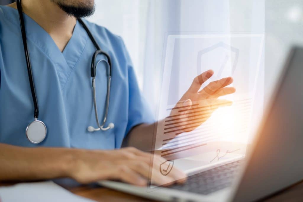 virtual medical receptionist solutions, doctor using laptop