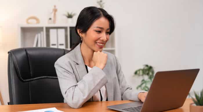 virtual medical receptionist woman smiling using a laptop