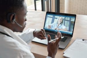 virtual medical receptionists and in-house staff, doctor talking to a patient virtual