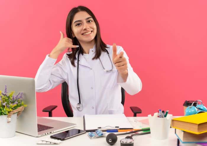 why a virtual medical receptionist is worth It, female doctor using a laptop