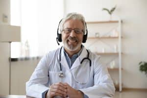 implementation of virtual medical receptionists happy doctor using headphone