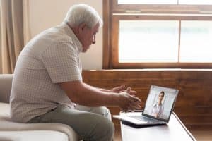 saving money with virtual medical receptionist old man consult from the doctor online