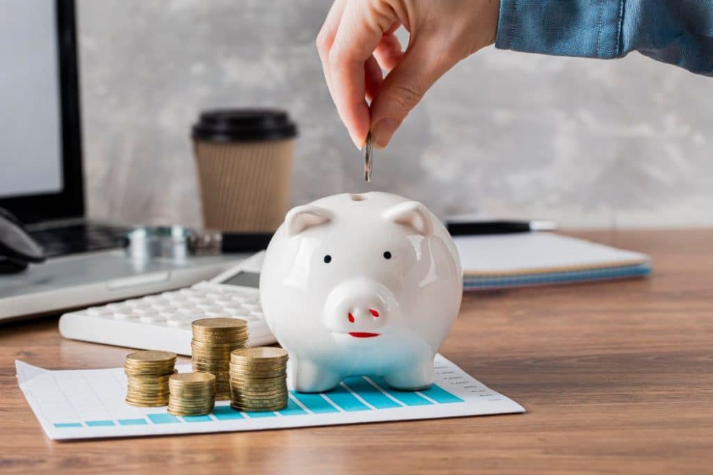 saving money with virtual medical receptionist saving money in piggy bank