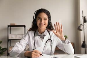 virtual medical receptionists are revolutionizing, happy doctor using headphone