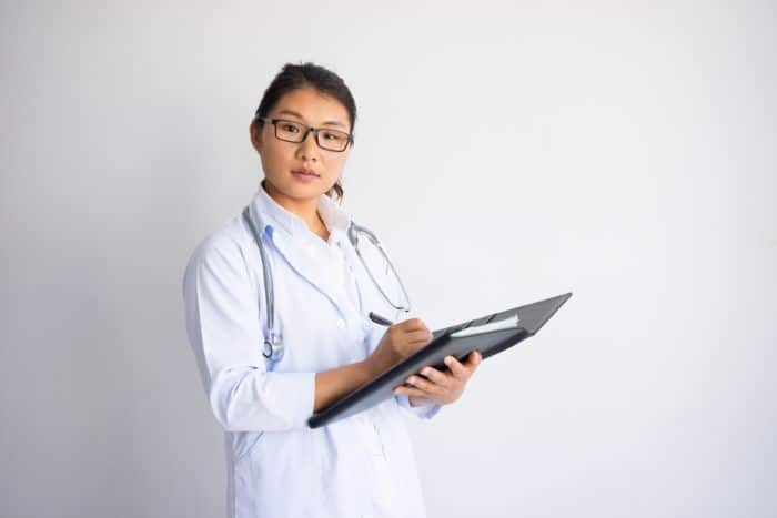 what does a medical administrative assistant do serious asian doctor