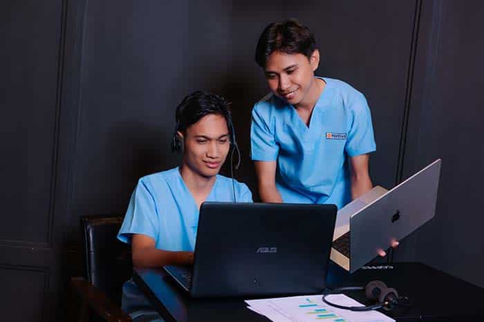vas holding laptop