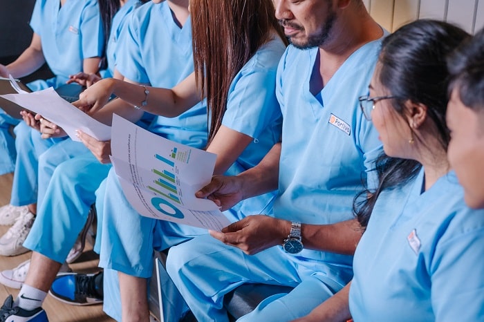 team portiva wearing blue scrub