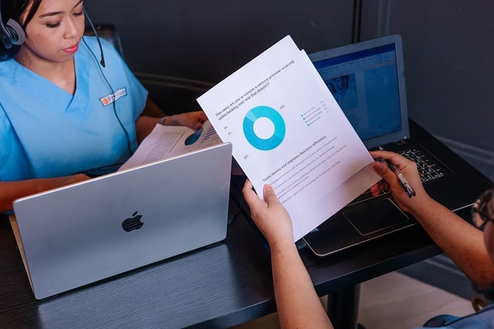 two people working at a desk