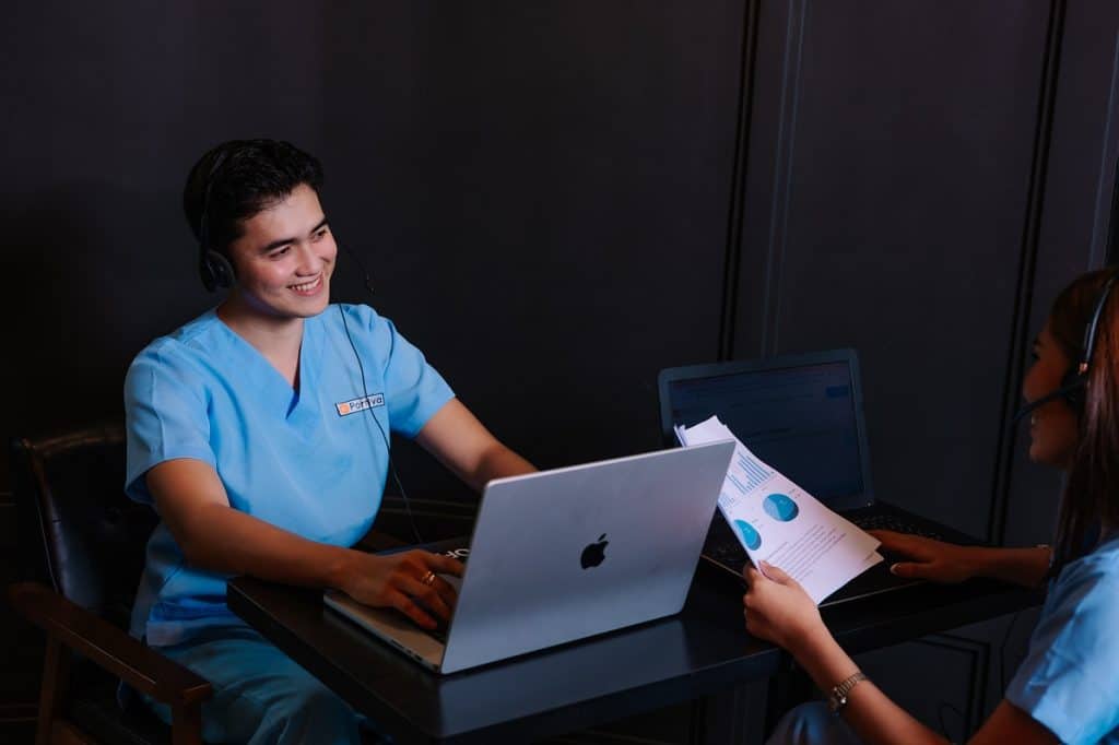 Patient reactivation follow up systems specialist reviewing patient outreach reports and scheduling follow-up appointments through a healthcare support workflow