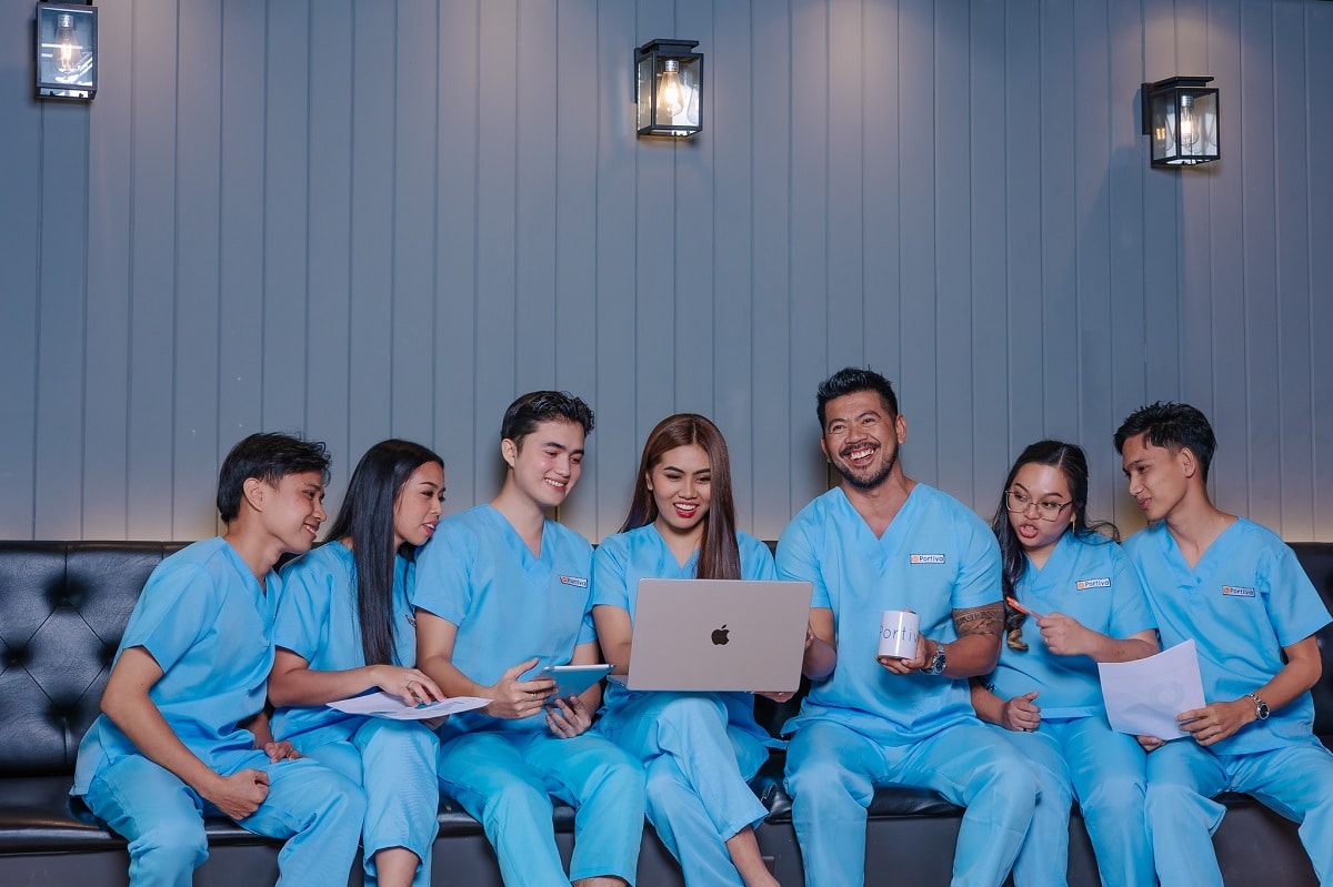 Receptionist for medical office answering patient phone calls, scheduling appointments, managing healthcare front desk communication, and supporting a busy medical practice