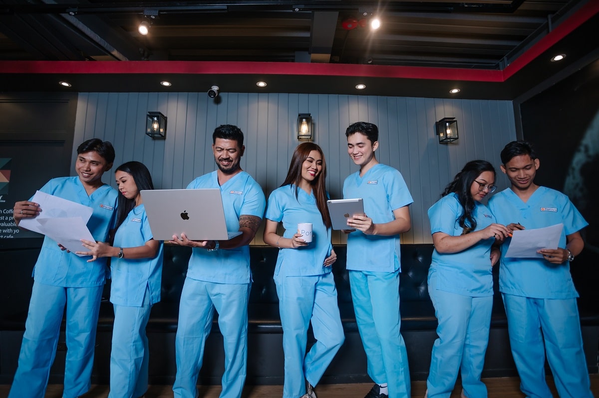 Event led patient trust healthcare practices team of healthcare administrative professionals collaborating with laptops